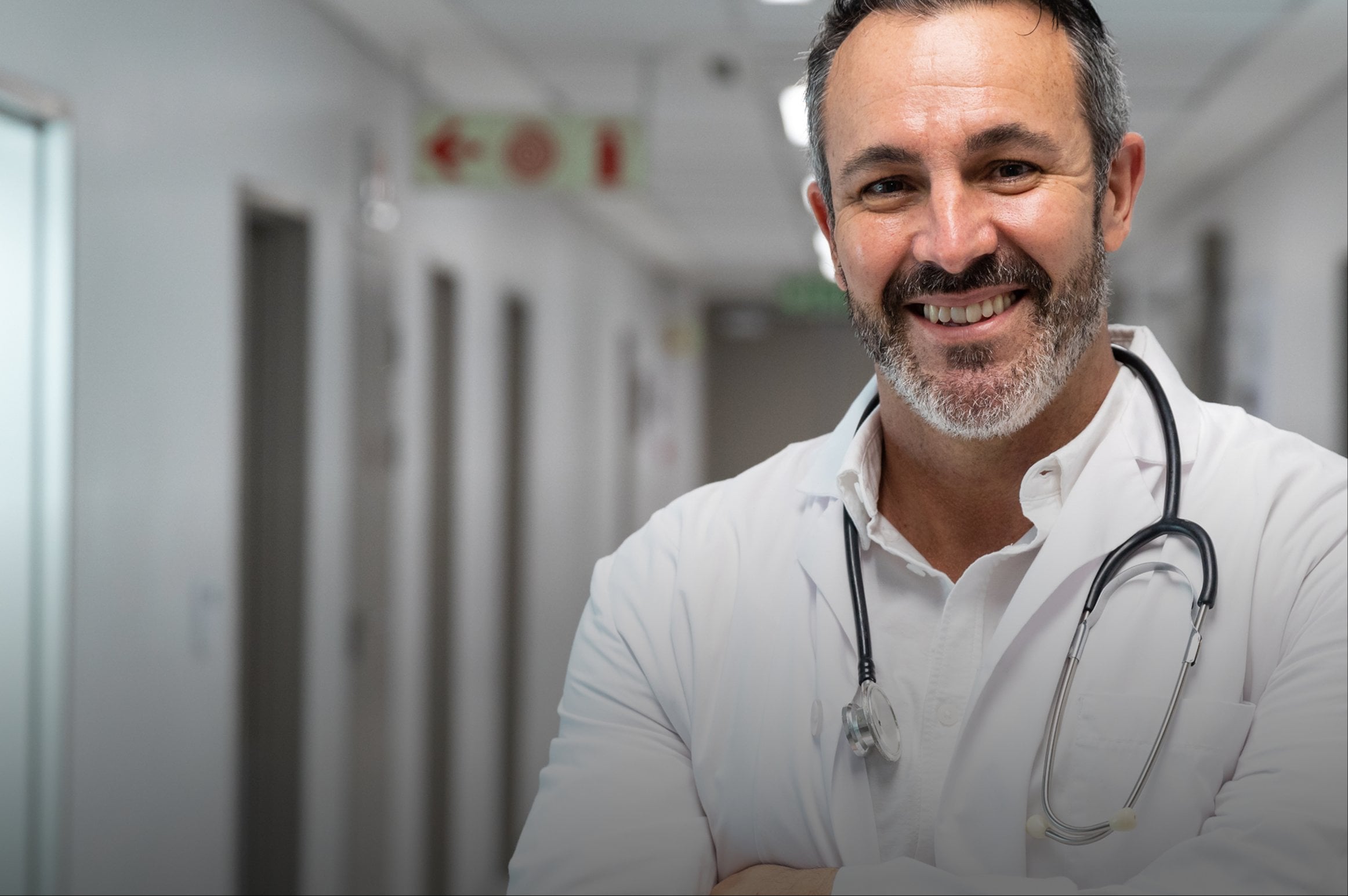 Physician on the Rugiet Health medical team in a clinic hallway