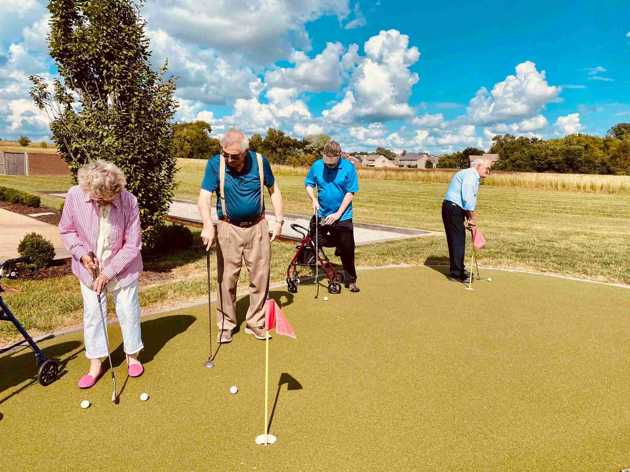 Vitality Living residents enjoying the Spring Hill putting green